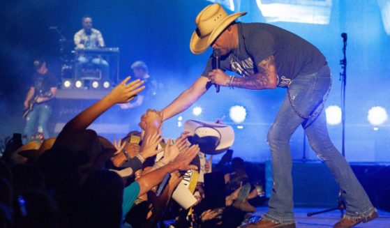 Jason Aldean greets fans while performing at Country Thunder in Twin Lakes, Wisconsin, on Saturday.