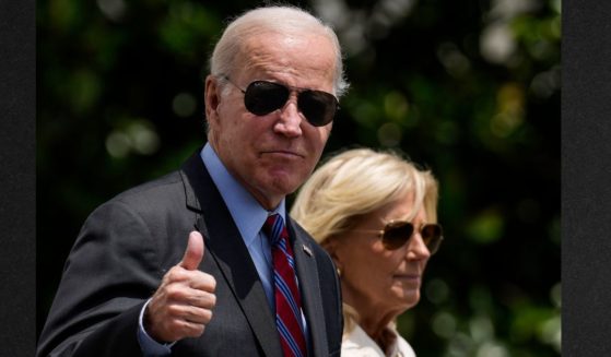 President Joe Biden gives a thumbs up as he walks with first lady Jill Biden to Marine One on the South Lawn of the White House July 14. A newly released document appears to confirm that Joe Biden is "the big guy" referred to in correspondence regarding an alleged deal for illicit payments from a Ukranian energy firm while Biden was vice president.