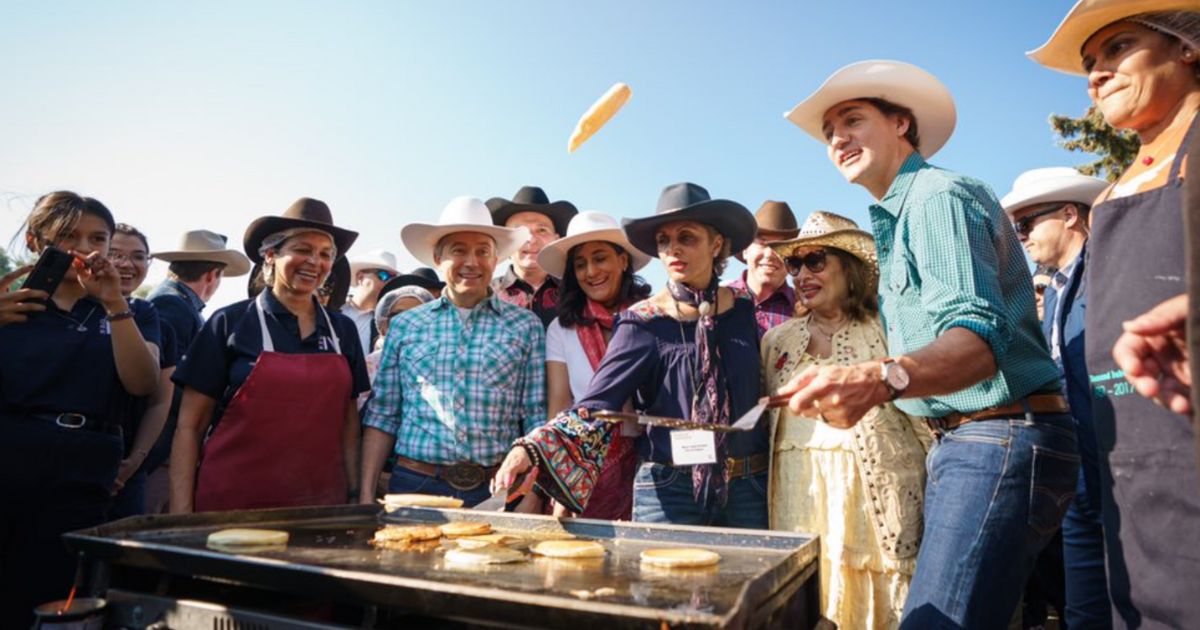 Canadian Prime Minister Justin Trudeau, second from right, was seen flipping pancakes at a stampede breakfast in Calgary on Saturday.