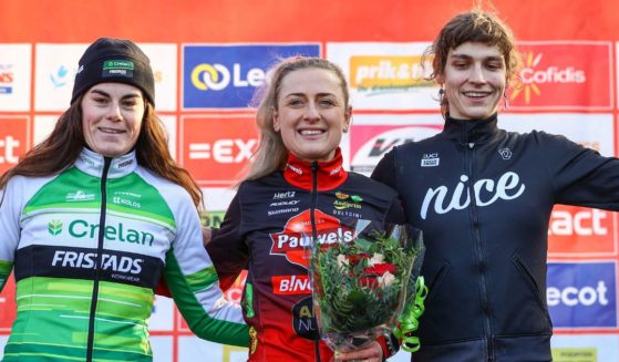 Transgender U.S. cyclist Austin Killips, right, stands on the podium alongside two female competitors -- Marion Norbert Riberolle of Belgium and Denise Betsema of the Netherlands -- after the women's elite race of the Kasteelcross in Zonnebeke, Belgium, on Jan. 21.