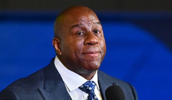 Magic Johnson speaks during the International Poverty Forum at the Delta Flight Museum in Atlanta on March 17.
