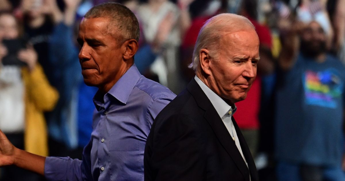 Former President Barack Obama, left, and President Joe Biden, right, attend a campaign rally for Democrats in Philadelphia, Pennsylvania, on Nov. 5, 2022.
