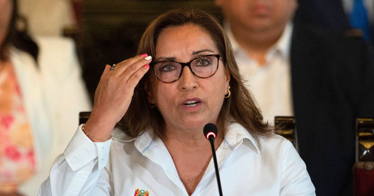 Peruvian President Dina Boluarte, accompanied by her ministerial team, speaks during a news conference at the Government Palace in Lima on May 3.