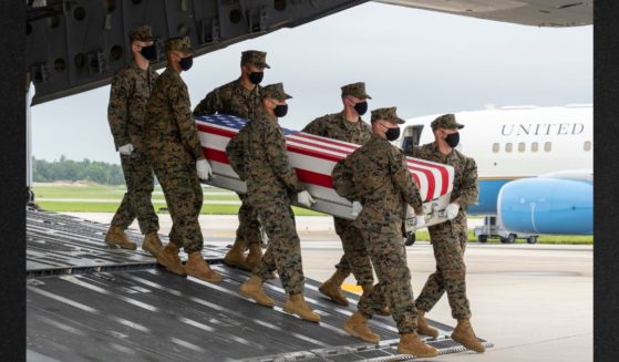 A U.S. Marine Corps carry team transfers the remains of Marine Corps Sgt. Nicole L. Gee of Sacramento, California, at Dover Air Force Base, Delaware, in a file photo from Aug. 29, 2021. Gee's family said the military refused to pay for the fallen Marine's body to be shipped to Arlington National Cemetery in Virginia after her funeral in California.