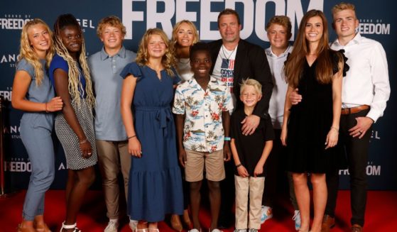Tim Ballard, middle, who the movie "Sound of Freedom" is based on, attends the movie premier in Vineyard, Utah, with family and friends on June 28.