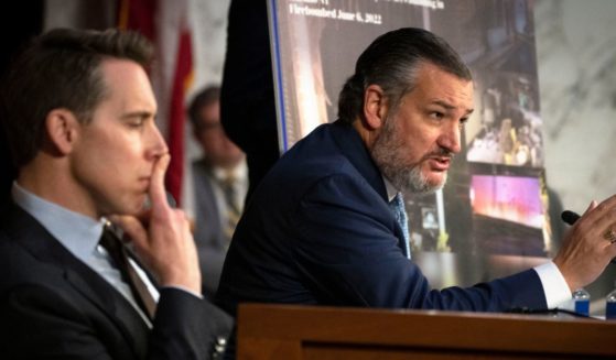 Republican Sen. Josh Hawley of Missouri, left, listens as Republican Sen. Ted Cruz of Texas, right, questions Attorney General Merrick Garland during a Senate Judiciary Committee hearing examining the Department of Justice, at the Capitol in Washington, D.C., on March 1.