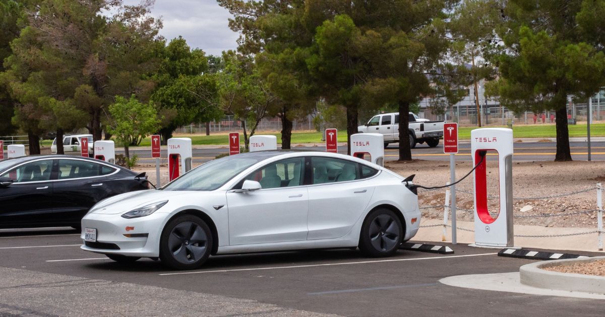 Tesla electric vehicles are being charged at a station in Kingman, Arizona, on June 22, 2022.