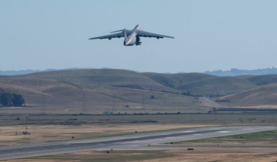 a C-5M Super Galaxy takes off from Travis Air Force Base
