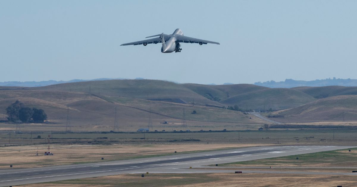 a C-5M Super Galaxy takes off from Travis Air Force Base