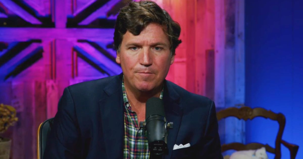 Tucker Carlson speaks on Russell Brand's "Stay Free" podcast.