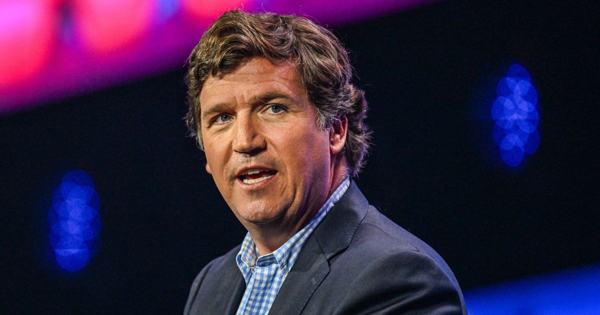 Tucker Carlson speaks at the Turning Point Action USA conference in West Palm Beach, Florida, on Saturday.