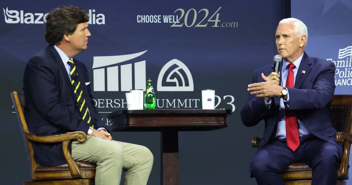 Tucker Carlson, left, interviews Republican presidential candidate and former Vice President Mike Pence at the Family Leadership Summit in Des Moines, Iowa, on July 14.
