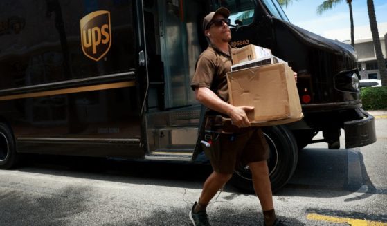 A UPS driver makes a delivery in Miami, Florida, on June 30.
