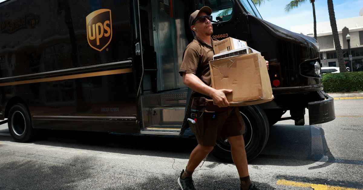 A UPS driver makes a delivery in Miami, Florida, on June 30.