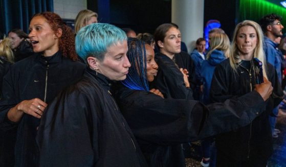 Megan Rapinoe, center left, and Crystal Dunn pose for photos as members of the U.S. Women's National Team attend the official FIFA welcoming ceremony at Spark Arena in Auckland, New Zealand, on Saturday.