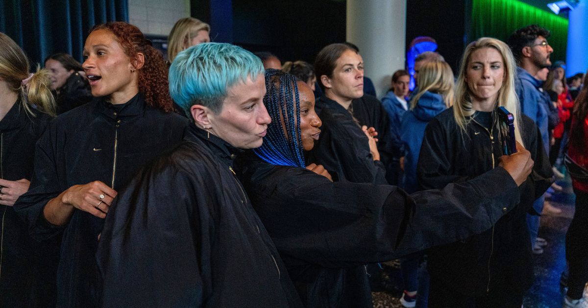 Megan Rapinoe, center left, and Crystal Dunn pose for photos as members of the U.S. Women's National Team attend the official FIFA welcoming ceremony at Spark Arena in Auckland, New Zealand, on Saturday.