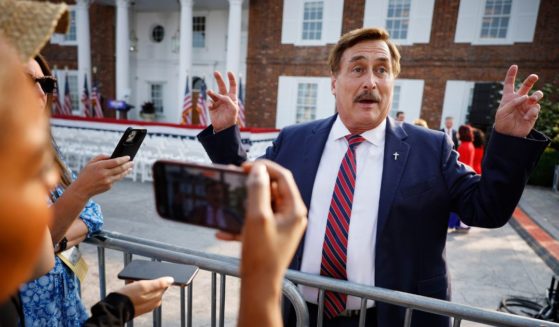 MyPillow CEO Mike Lindell talks with reporters outside the clubhouse at the Trump National Golf Club in Bedminster, New Jersey, before a speech by former President Donald Trump on June 13.