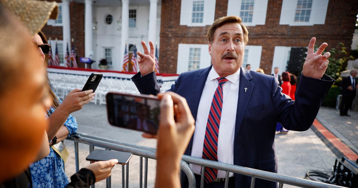 MyPillow CEO Mike Lindell talks with reporters outside the clubhouse at the Trump National Golf Club in Bedminster, New Jersey, before a speech by former President Donald Trump on June 13.
