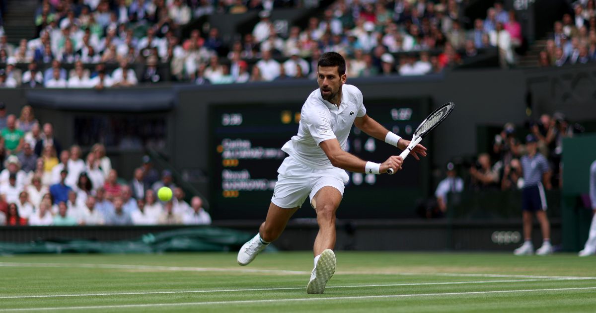 Novak Djokovic tries to make a shot during the Wimbledon men's singles final against Carlos Alcaraz at the All England Lawn Tennis and Croquet Club in London on July 16.