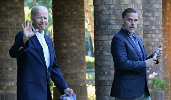 President Joe Biden waves alongside his son Hunter Biden after attending mass at Holy Spirit Catholic Church in Johns Island, South Carolina on Aug. 13, 2022.