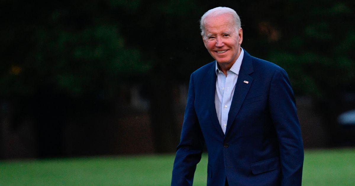 President Joe Biden smiles as he walks away from Marine One at Fort McNair in Washington, D.C., on Sunday.