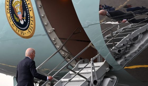 US President Joe Biden boards Air Force One as he departs from the Vilnius International Airport in Vilnius, Lithuania, on July 12, 2023, after the end of NATO Summit.