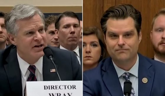 FBI Director Christopher Wray, left, is questioned by Florida Rep. Matt Gaetz on Wednesday.