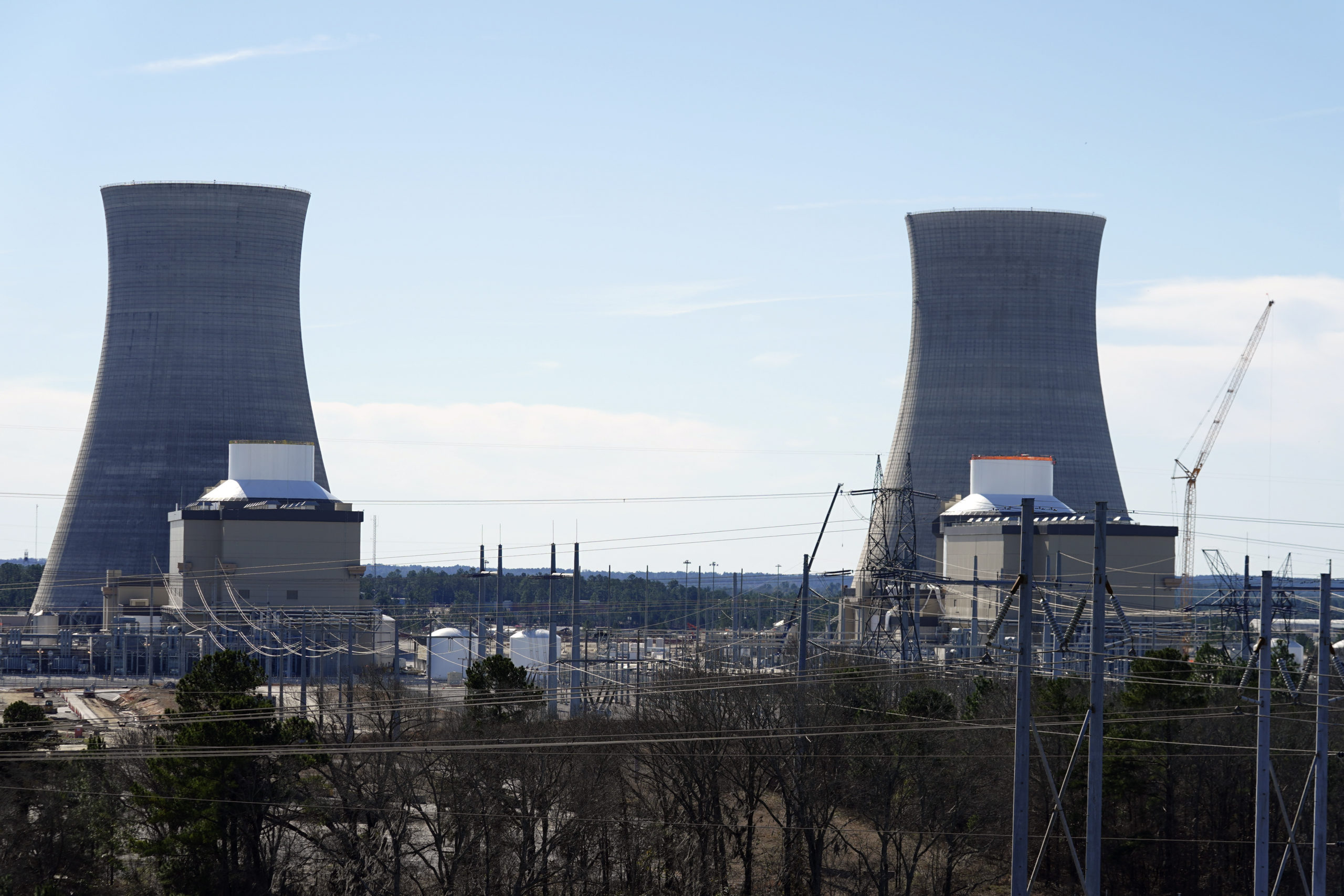 Units 3, left, and 4 and their cooling towers stand at Georgia Power Co.'s Plant Vogtle nuclear power plant, Jan. 20, 2023, in Waynesboro, Ga. (John Bazemore / AP)