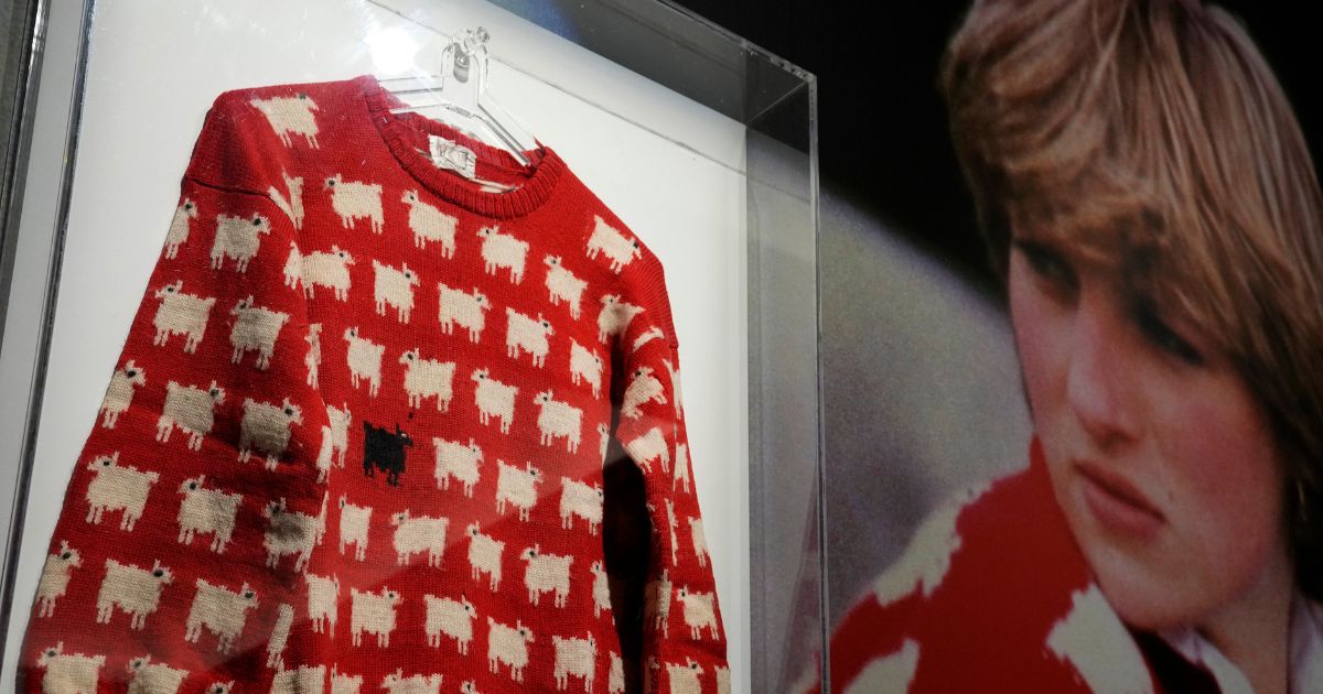 The historic Princess Diana black sheep jumper is on display at the auction house Sotheby's in London, Monday.