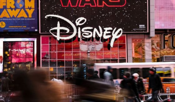 The Disney logo is displayed outside the Disney Store in Times Square, Dec.14, 2017, in New York City.