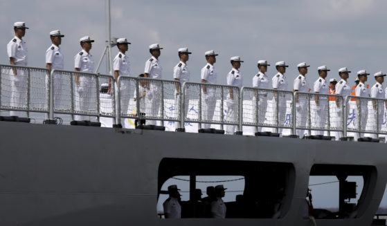 Chinese navy sailors stand in formation on board the naval training ship, Qi Jiguang, as it docks at Manila's port, Philippines in a file photo from June 14. China says its navy ships are preparing for joint exercises with Russia's sea forces in a sign of Beijing's continuing support for Moscow's invasion of neighboring Ukraine.