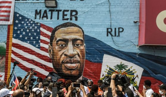 A mural painted by artist Kenny Altidor depicting George Floyd is unveiled on a sidewall of CTown Supermarket on July 13, 2020, in the Brooklyn borough New York City.