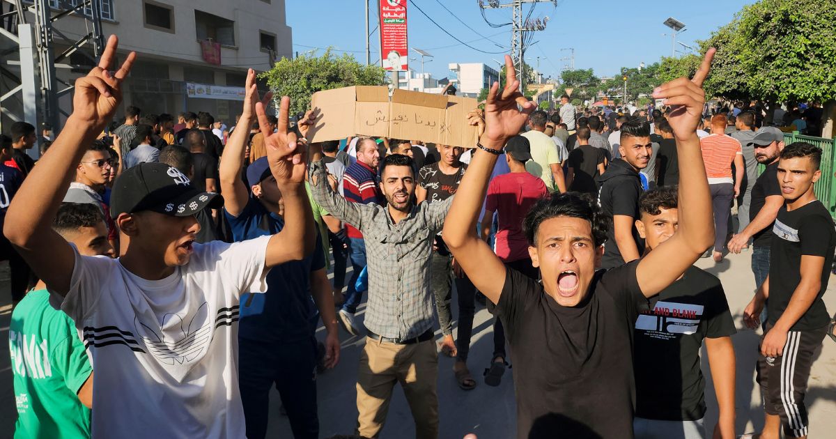 Palestinian demonstrators chant slogans during a protest against the territory's chronic power outages and difficult living conditions along the streets of Khan Younis, southern Gaza Strip, on Sunday.