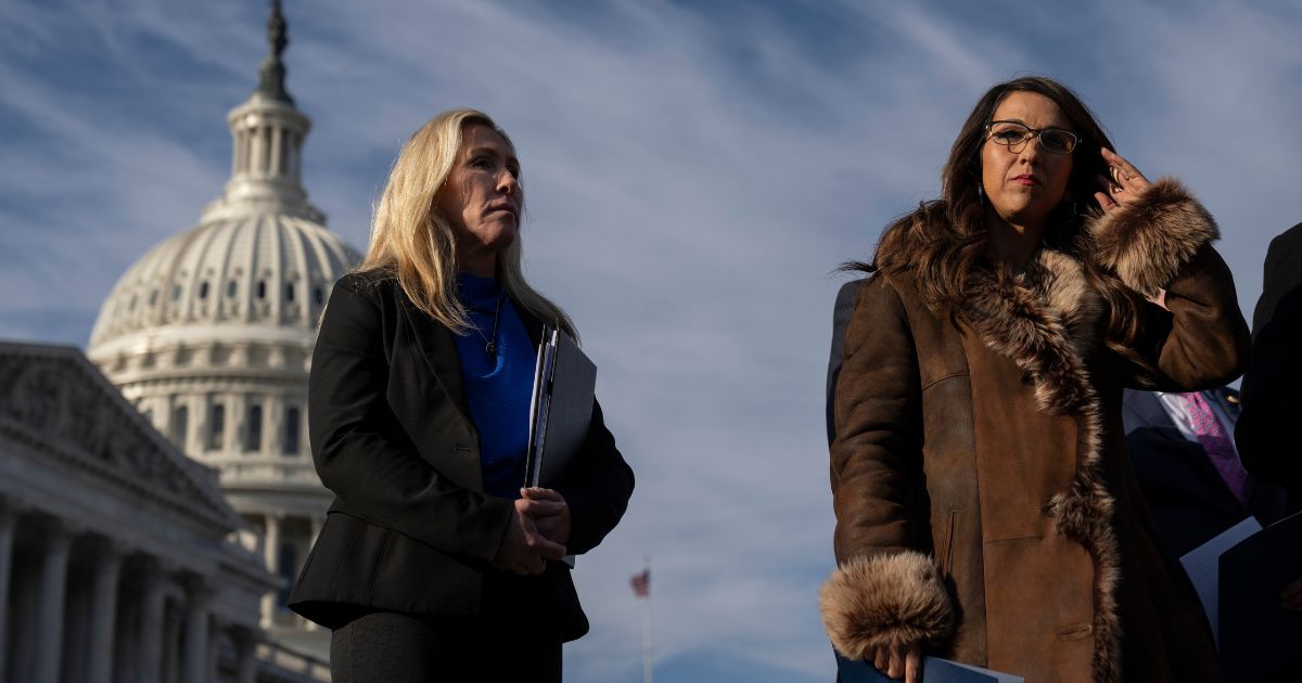 Rep. Marjorie Taylor Greene (R-GA) and U.S. Rep. Lauren Boebert (R-CO) wait their turn to speak during a news conference outside the U.S. Capitol on Feb. 1 in Washington, D.C.