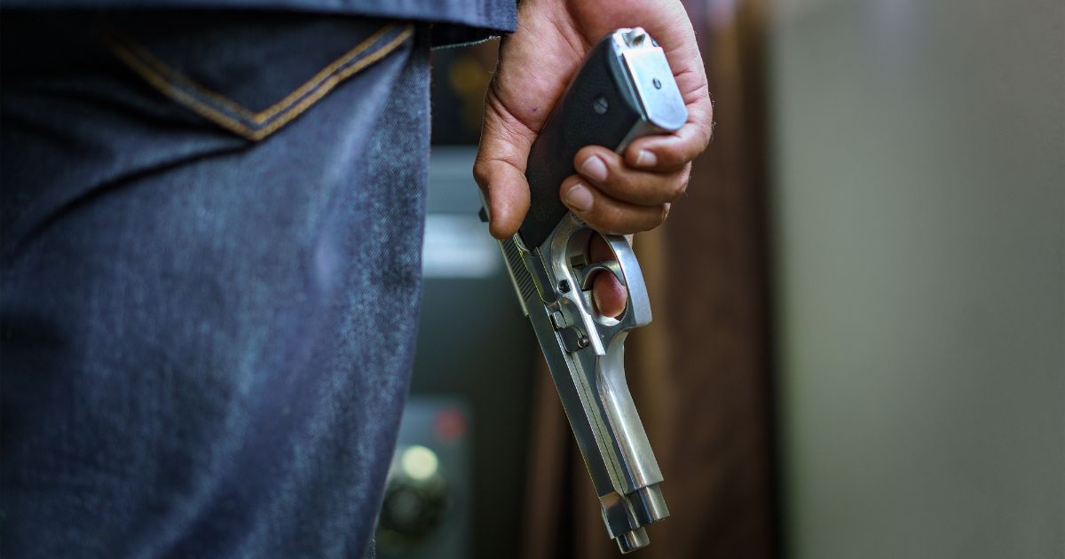 The above image is a man with a gun.