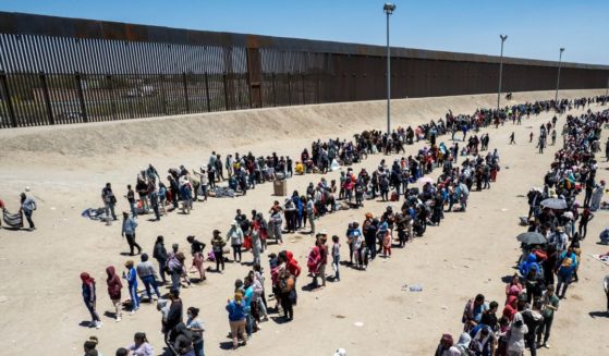 Illegal immigrants line up to be processed to make asylum claims at a makeshift camp in El Paso, Texas, on May 11.