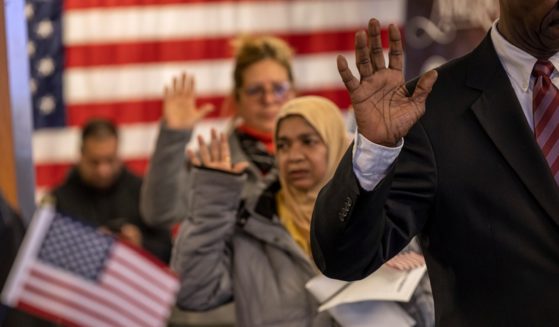 Immigrants take the oath of allegiance to the United States during a naturalization ceremony in a February file photo in Newark, New Jersey.