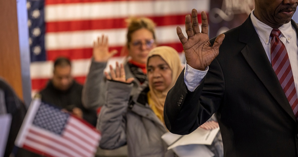 Immigrants take the oath of allegiance to the United States during a naturalization ceremony in a February file photo in Newark, New Jersey.