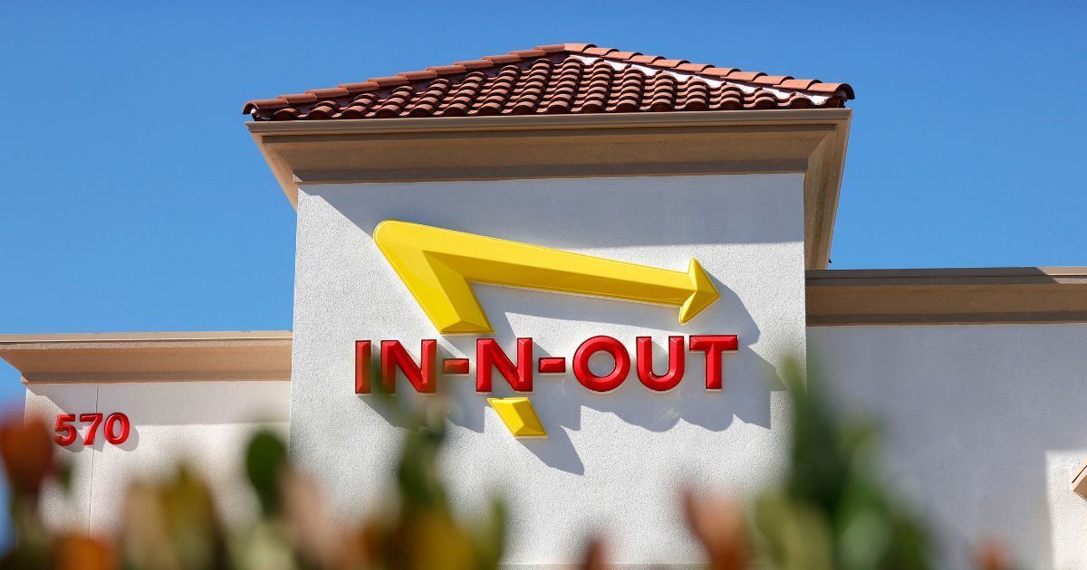The In-n-Out logo is displayed on the front of an In-n-Out restaurant on October 28, 2021 in Pleasant Hill, California.