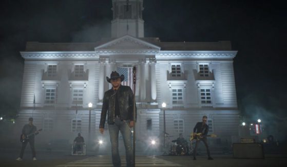 Jason Aldean stands while shooting the new music video for his song “Try That in a Small Town.”