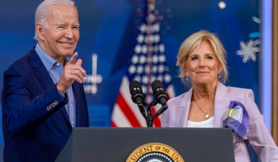 President Joe Biden and first lady Jill Biden greet the audience at a National Education Association event at the White House on the Fourth of July.
