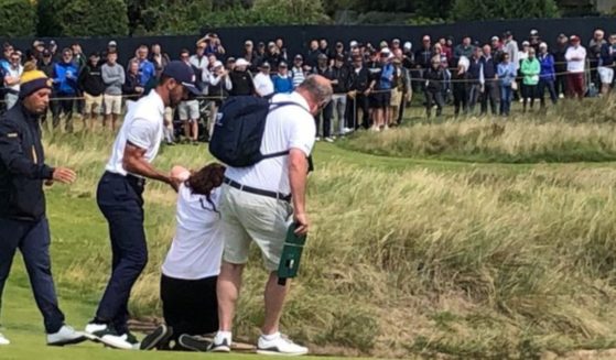 Climate activists disrupted the British Open on Friday and were quickly apprehended.