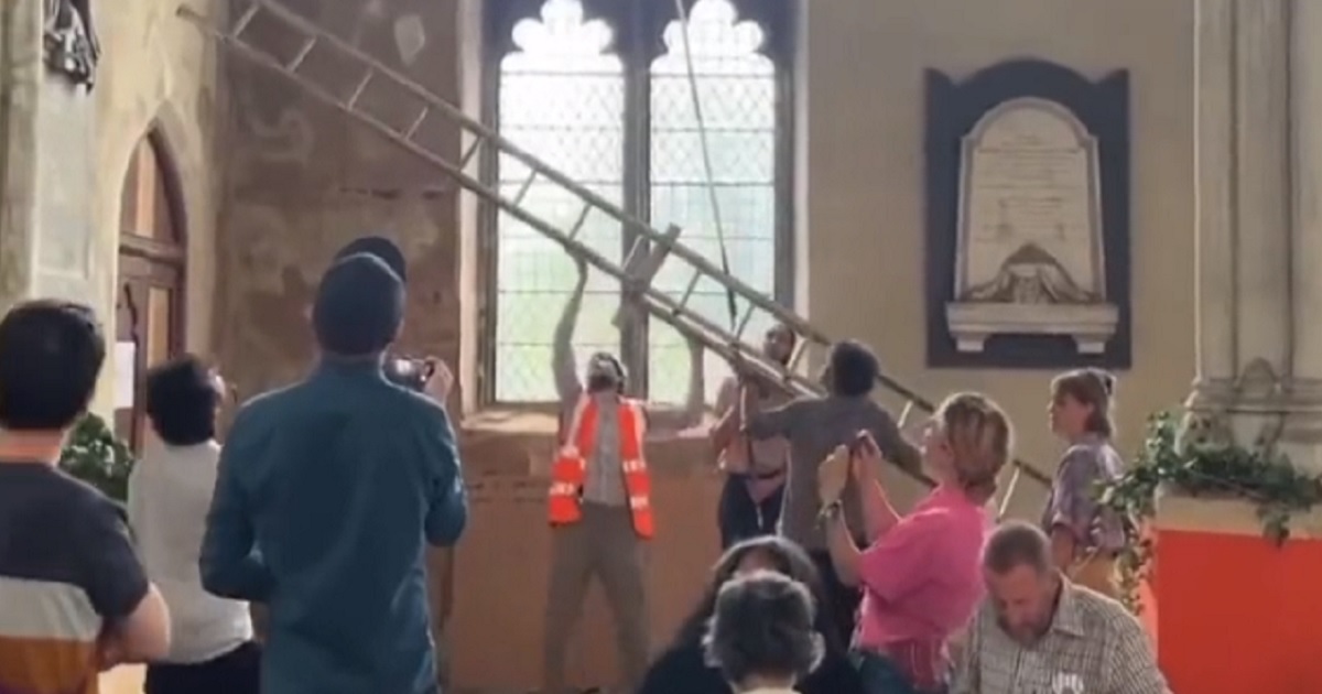 Ladders are put into service to try to capture devices disrupting an environmental activist group's banquet.