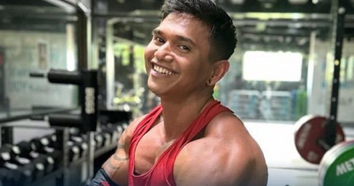 Bodybuilding influencer Justyn Vicky smiles in an Instagram photo.