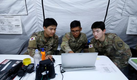 Personnel from the South Korean Navy's 5th Mine/Amphibious Flotilla and US Army's 29th Harbormaster Detachment from Hawaii discuss an operation during a joint South Korean-US military CDEx (Combined Distribution Exercise) at the Combined Command Post in Dogu Coast, Pohang, on June 13, 2023.