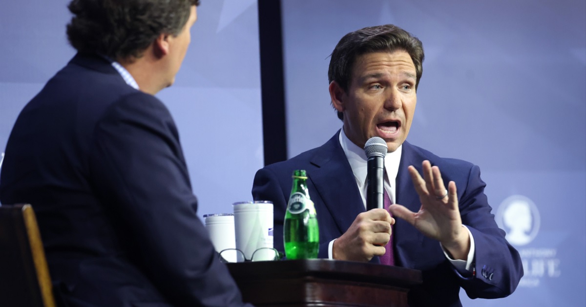 Florida Gov. Ron DeSantis is interviewed by former Fox News host Tucker Carlson Friday at the Family Leadership Summit in Des Moines, Iowa.