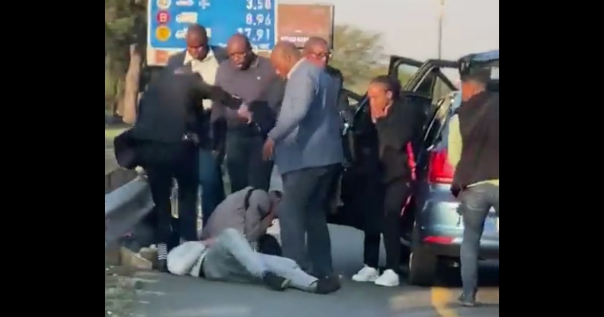 This Twitter screen shot purports to show a group of South African police officers attacking someone on the side of the road.