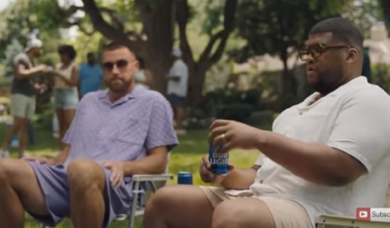 Kansas City Chiefs tight end Travis Kelse, left, in a new Bud Light ad.
