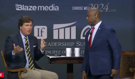 South Carolina Sen. Tim Scott speaks with host Tucker Carlson on Friday during a forum.