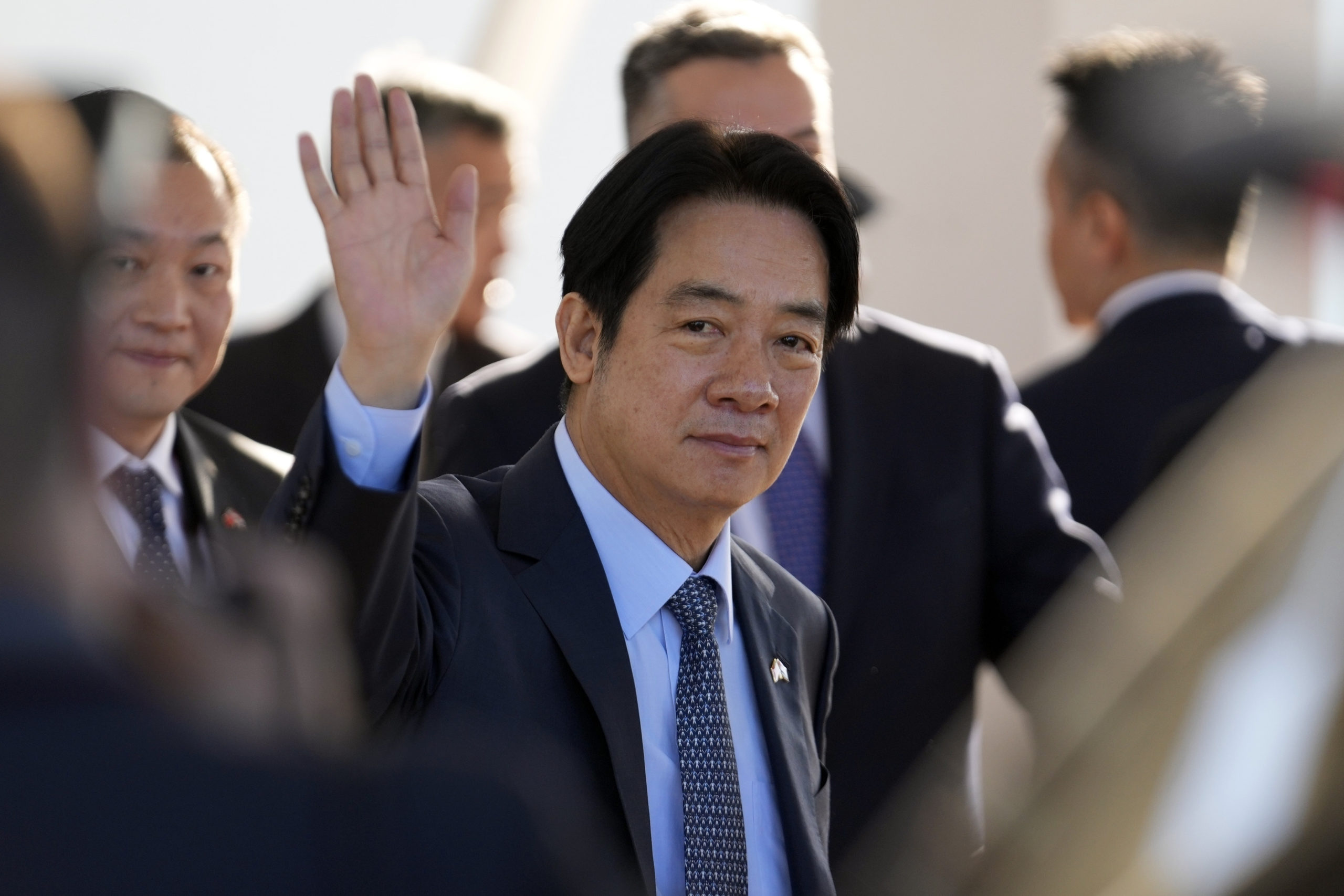 Taiwan's Vice President William Lai Ching-te waves after landing at Silvio Pettirossi airport in Luque, Paraguay, on Aug. 14. The Chinese military launched drills around Taiwan on Saturday as a "stern warning” over what it called collusion between “separatists and foreign forces” days after Lai stopped over in the United States.